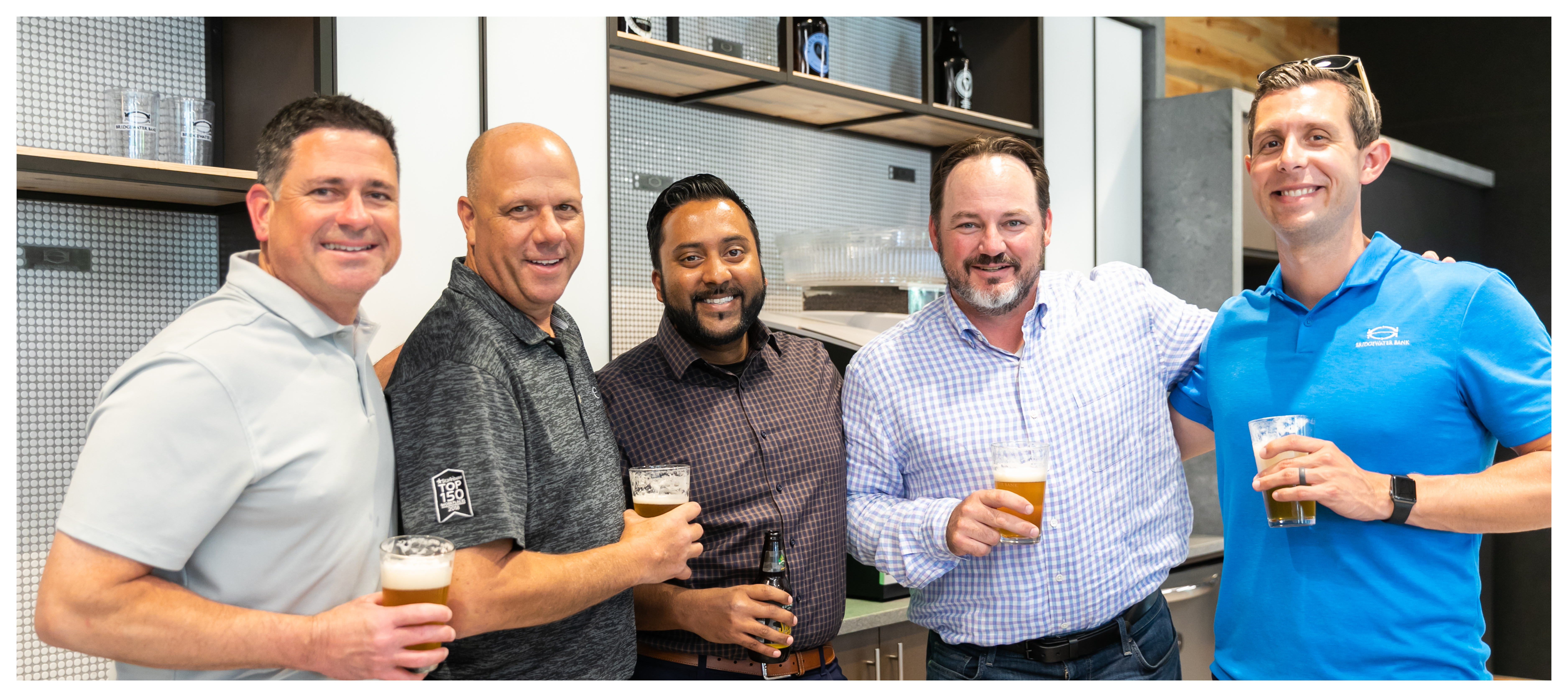 Group photo of Palmciti Bank team members at an internal happy hour.
